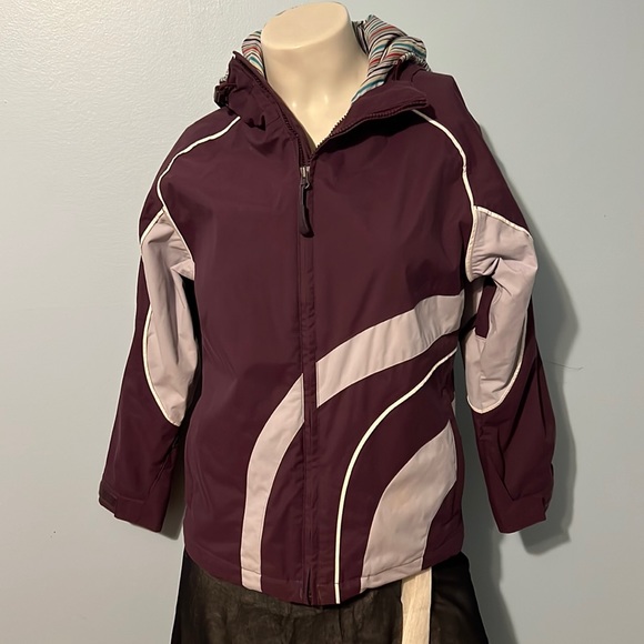 Burton girl’s system snowboarding jacket. Model ladies size 6 jacket was snug.